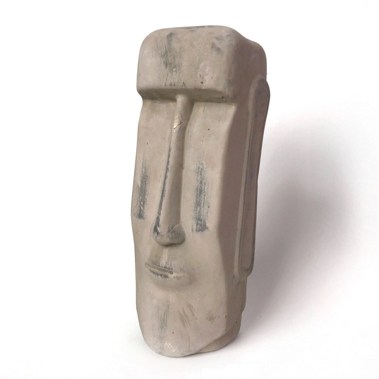 beige ceramic moai figure head